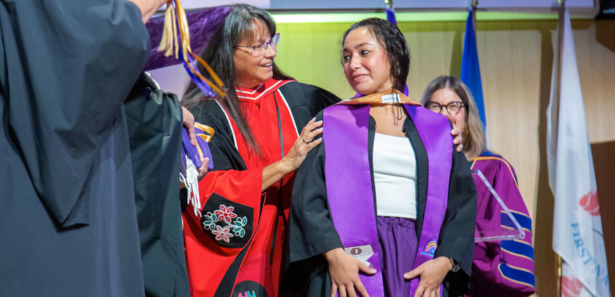 Social Work graduate on stage