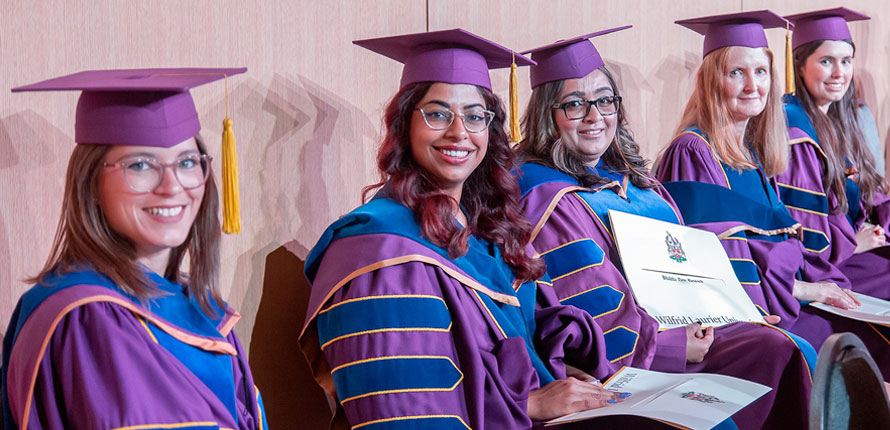 Doctoral students on stage