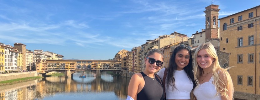 Students pose in front of canal in Neoma, France