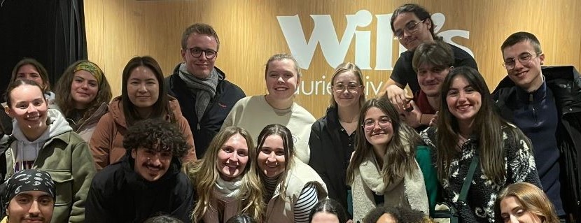 A group of incoming exchange students in front of Wilf's restaurant.