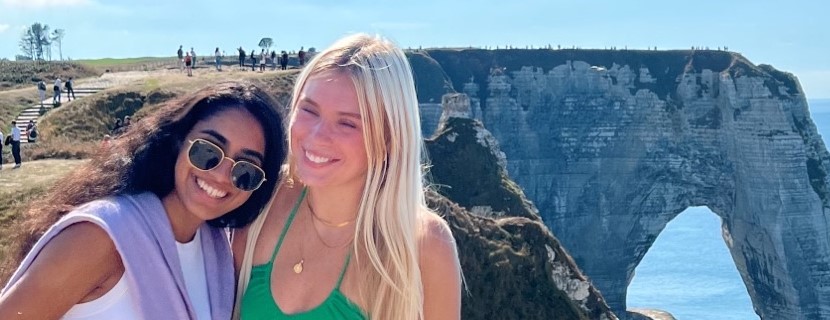 2 Laurier students overlooking a beach in France.