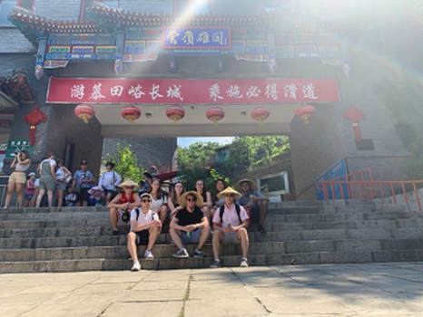 Spotlight story image pertaining to students sitting in front of a building in China