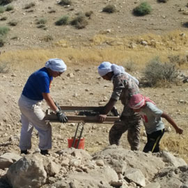 Students doing archaeology in desert