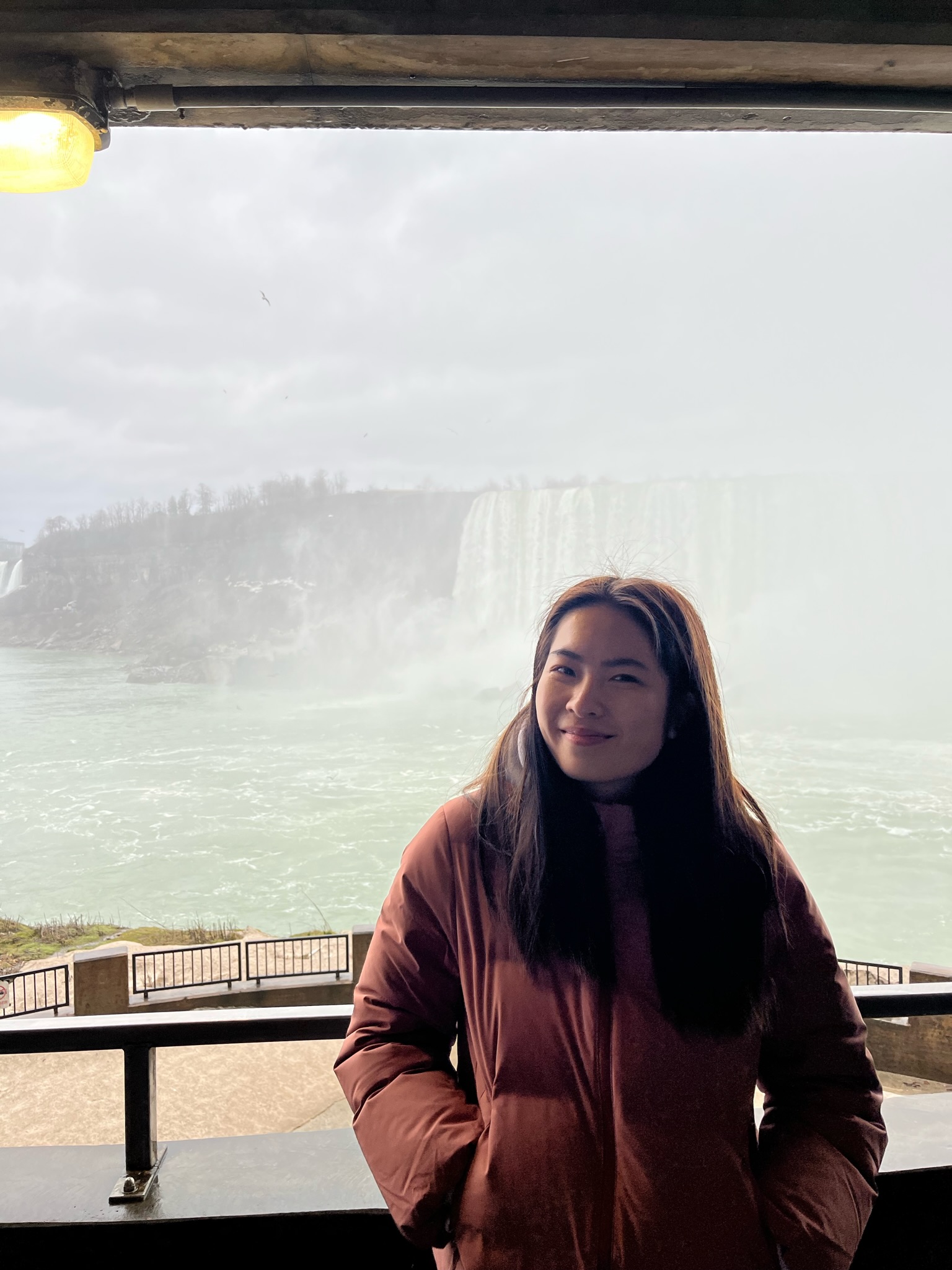 Student in front of Niagara falls