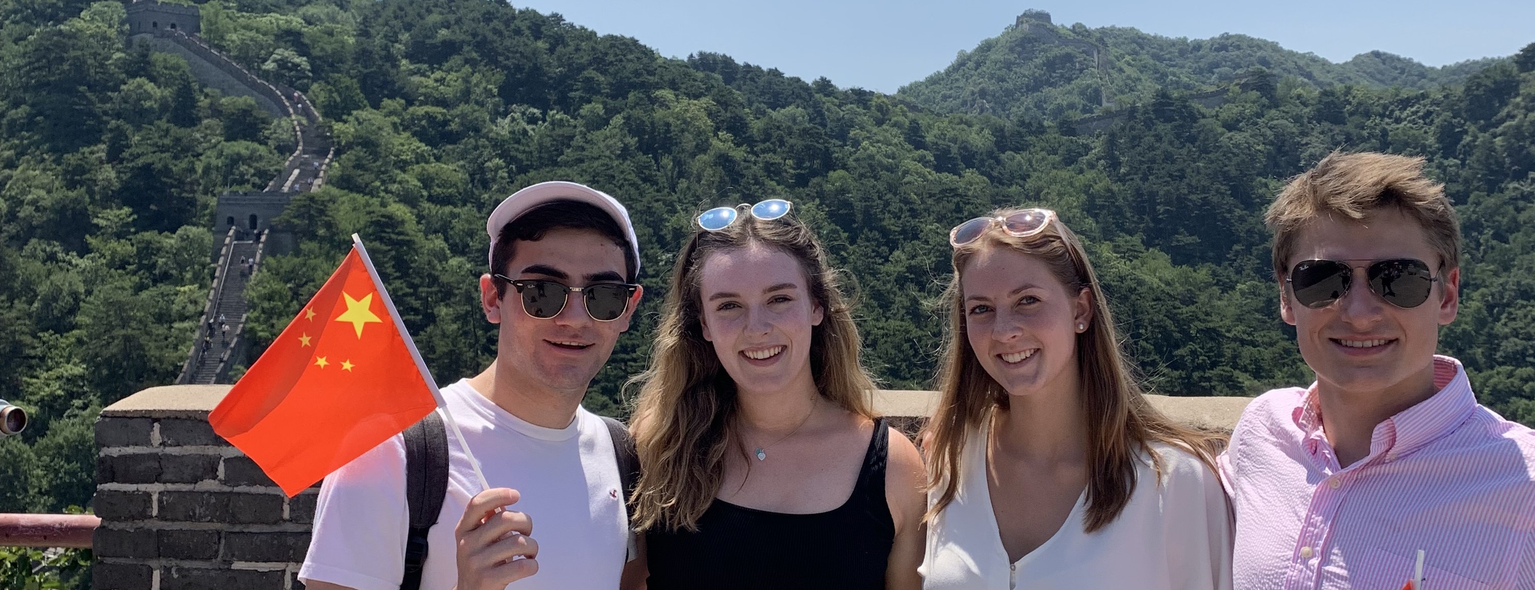 4 Laurier students in China standing on the Great Wall of China