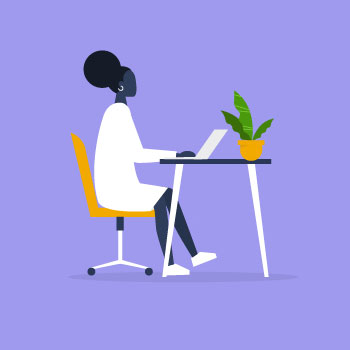 female student working on laptop at desk