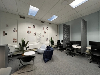 room with workstations, lounge chairs