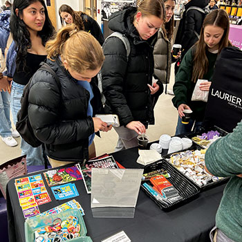 Students getting information at the Fair Trade booth.