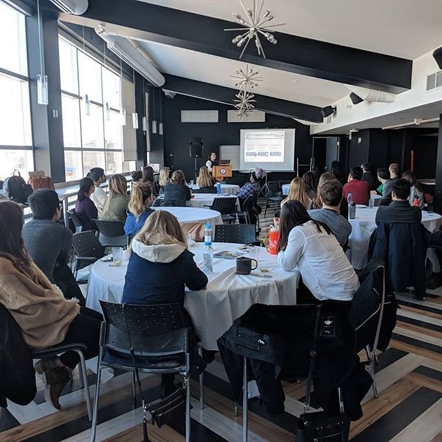 People listening to speaker.