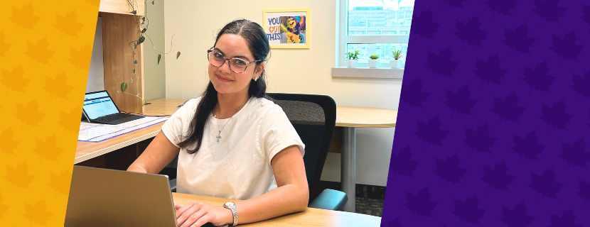 Co-op ambassador seated at desk.