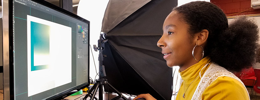 female sitting at a computer