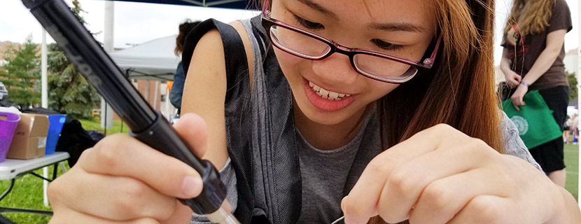 female using soldering irons