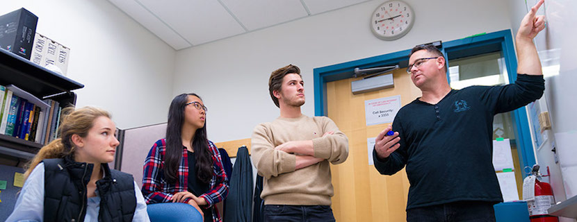 Ron Daniels works with students