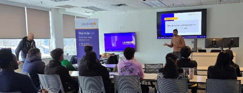 Presenter speaking to a group during StartUp Lab Milton event