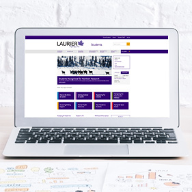 Image of a laptop with Laurier's student website homepage displayed