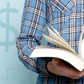 Hand holding a book next to a dollar sign