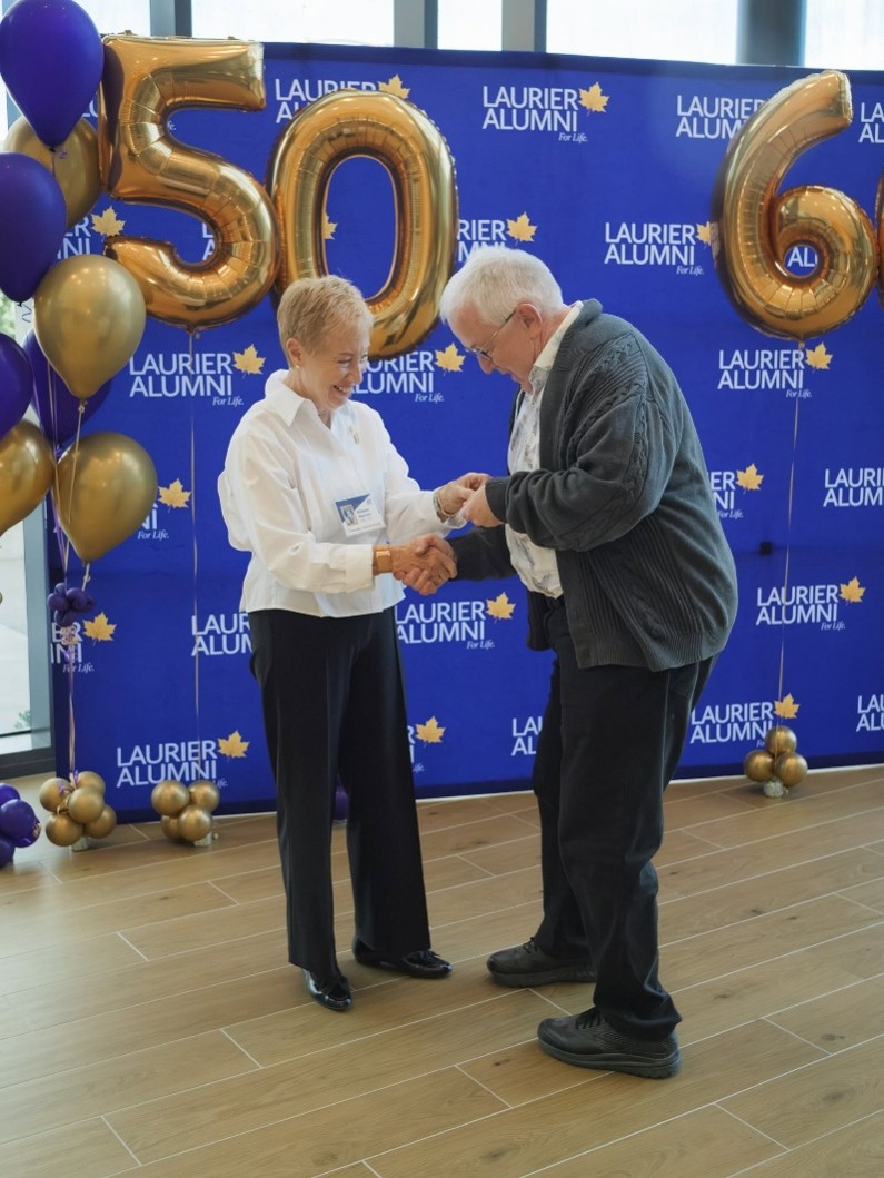 Alan Macnaughton receiving his 50th anniversary pin 