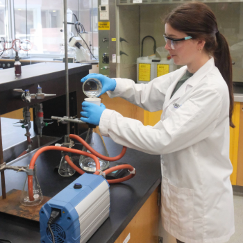 Spotlight story image pertaining to Lab technician Sam Zulian (MSc ‘23) demonstrates the new vacuum pump that replaced the water aspirator.