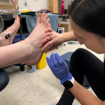 Kelly working on client's foot