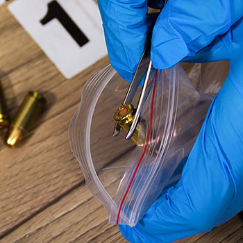 bullet being placed in bag