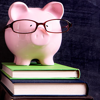 piggy bank on book stack