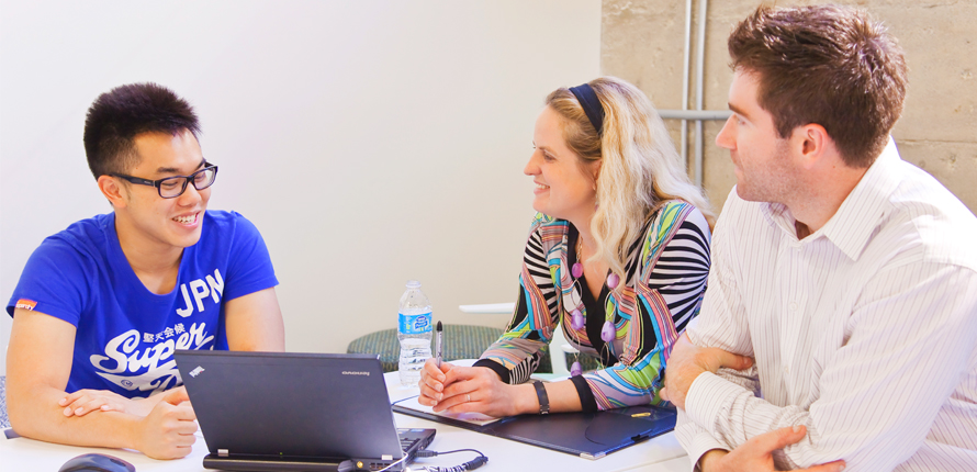 Student consulting with two financial specialists