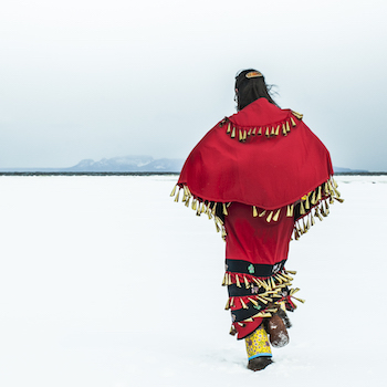 Image of Indigenous woman walking in snow