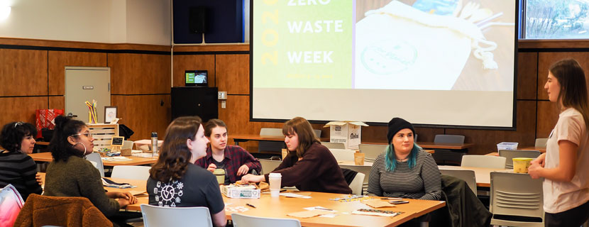 Staff member delivering workshop to students.