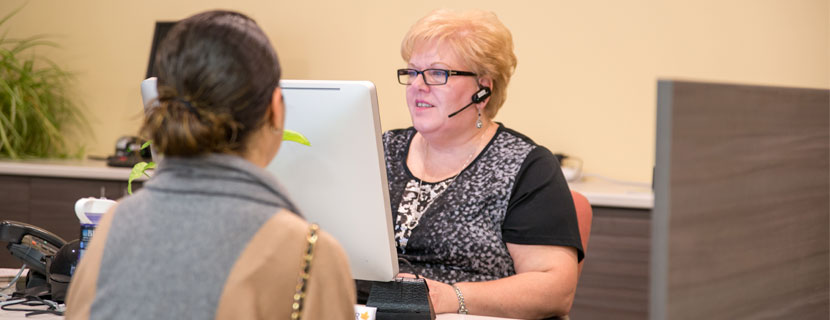 Receptionist speaking with student